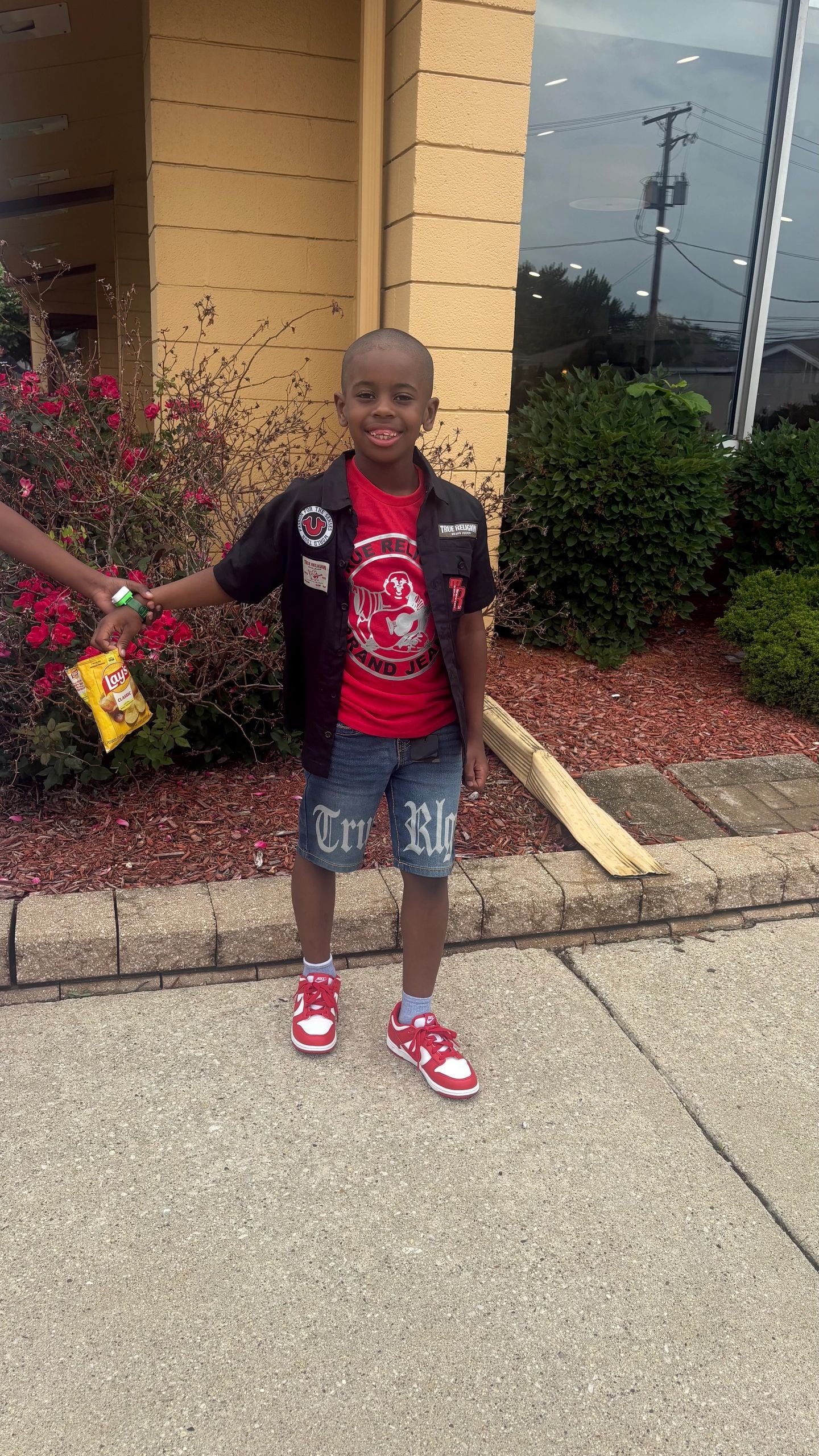 Kameryn outside building